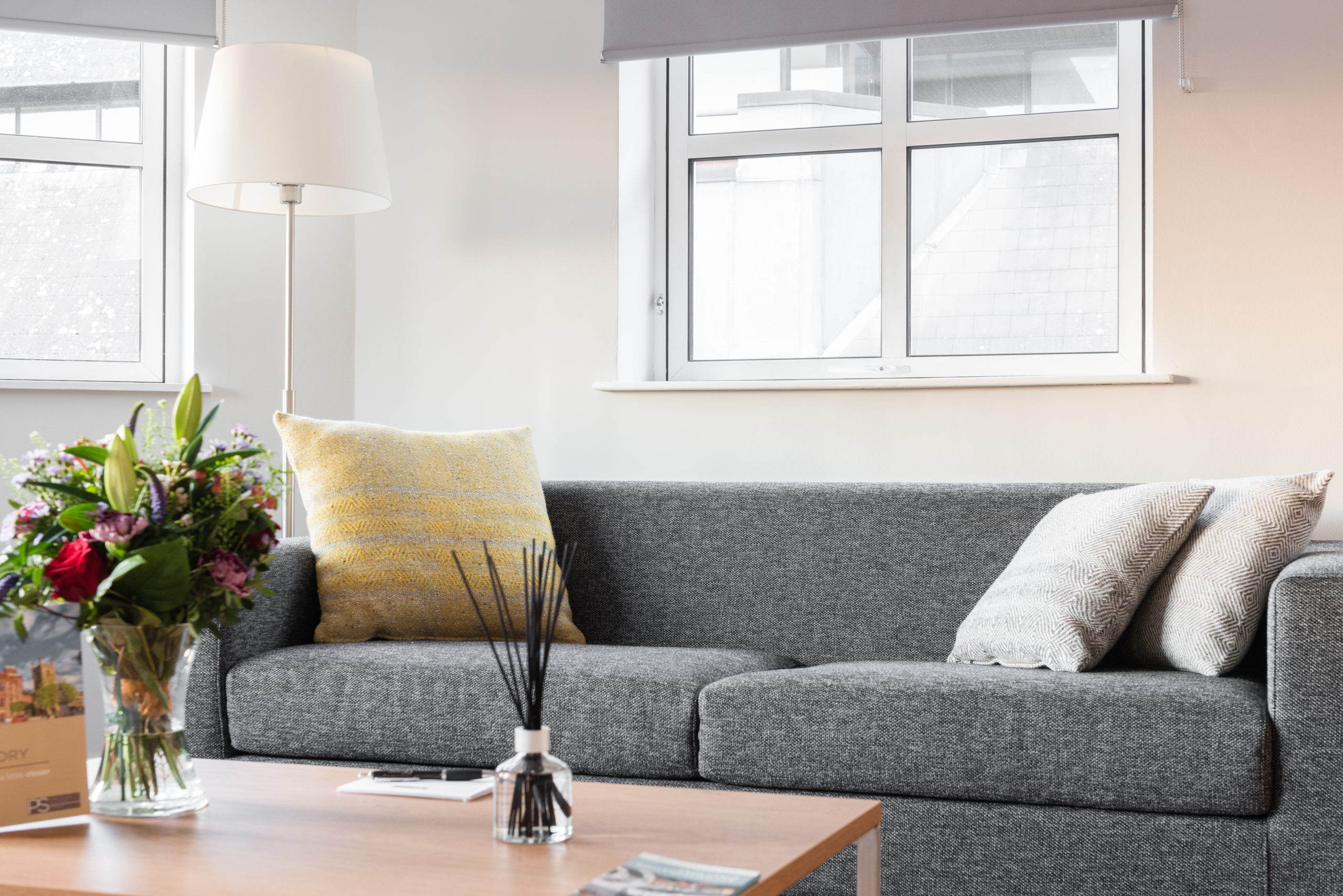 PREMIER SUITES Reading Couch In Living Area Scaled 1